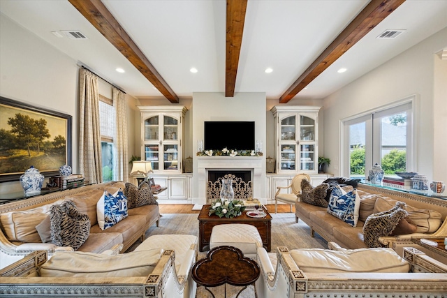 7614 Brykerwoods Dr, Houston, TX 77055 - living area with recessed lighting, beamed ceiling, wood finished floors, and a fireplace