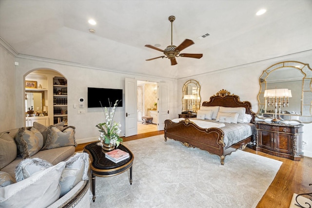 7614 Brykerwoods Dr, Houston, TX 77055 - bedroom with wood finished floors, arched walkways, recessed lighting, ornamental molding, and ceiling fan