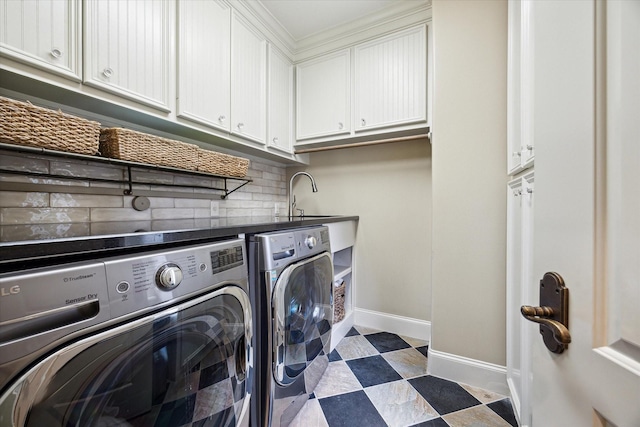 7614 Brykerwoods Dr, Houston, TX 77055 - washroom featuring washing machine and dryer and cabinet space