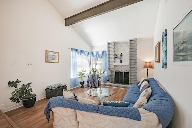 7642 Candlegreen Ln, Houston, TX 77071 - living area featuring beamed ceiling, wood finished floors, a brick fireplace, and high vaulted ceiling