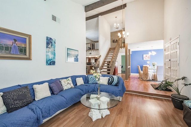 7642 Candlegreen Ln, Houston, TX 77071 - living area featuring a chandelier, high vaulted ceiling, stairway, wood finished floors, and beam ceiling