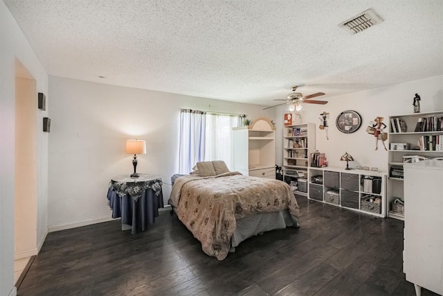 7642 Candlegreen Ln, Houston, TX 77071 - bedroom featuring a textured ceiling, dark wood-type flooring, and ceiling fan