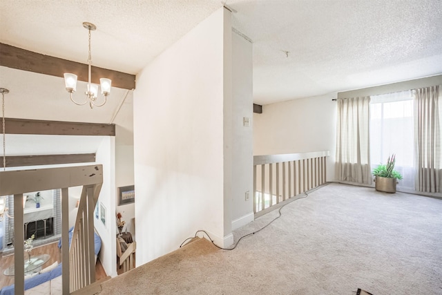 7642 Candlegreen Ln, Houston, TX 77071 - spare room featuring carpet flooring, a chandelier, and a textured ceiling