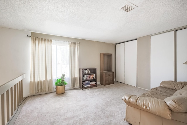 7642 Candlegreen Ln, Houston, TX 77071 - living area with light colored carpet and a textured ceiling