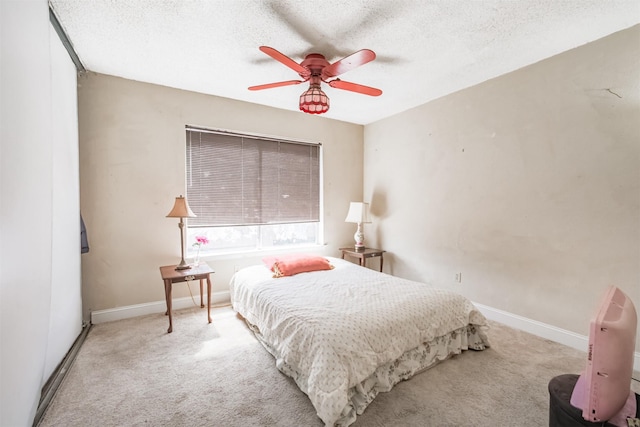 7642 Candlegreen Ln, Houston, TX 77071 - carpeted bedroom with a textured ceiling and a ceiling fan