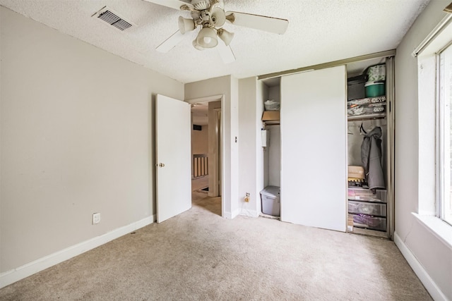 7642 Candlegreen Ln, Houston, TX 77071 - unfurnished bedroom with carpet flooring, a textured ceiling, and a ceiling fan