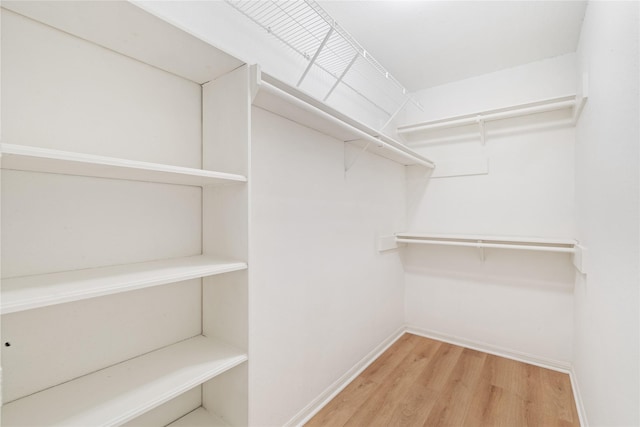 1714 Regal Blue Ct, Fresno, TX 77545 - spacious closet with wood finished floors