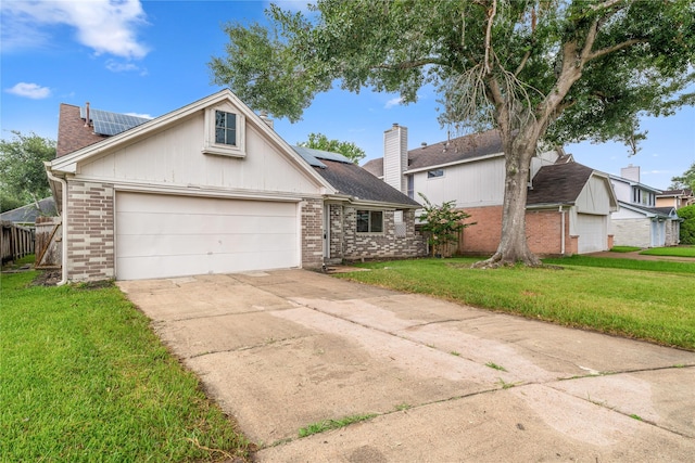 1714 Regal Blue Ct, Fresno, TX 77545 - view of front of property with brick siding, a front yard, roof mounted solar panels, and driveway