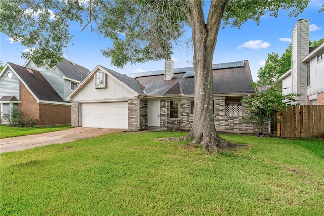 1714 Regal Blue Ct, Fresno, TX 77545 - view of front of home featuring brick siding, an attached garage, driveway, solar panels, and a chimney