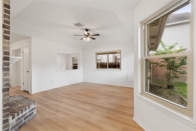 1714 Regal Blue Ct, Fresno, TX 77545 - unfurnished living room with light wood-style floors and a ceiling fan