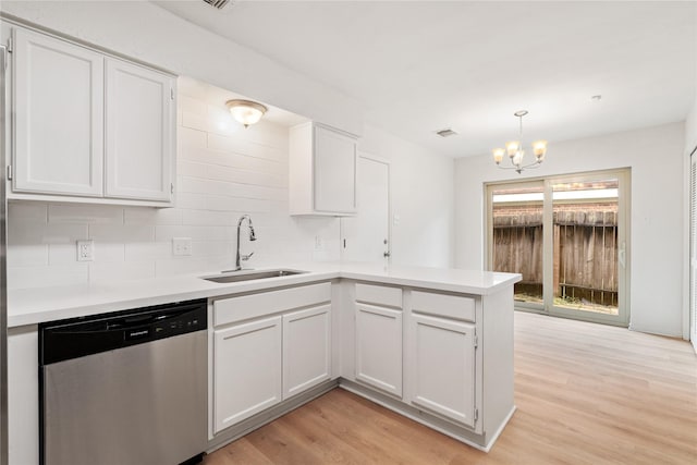1714 Regal Blue Ct, Fresno, TX 77545 - kitchen featuring stainless steel dishwasher, a peninsula, light countertops, and tasteful backsplash