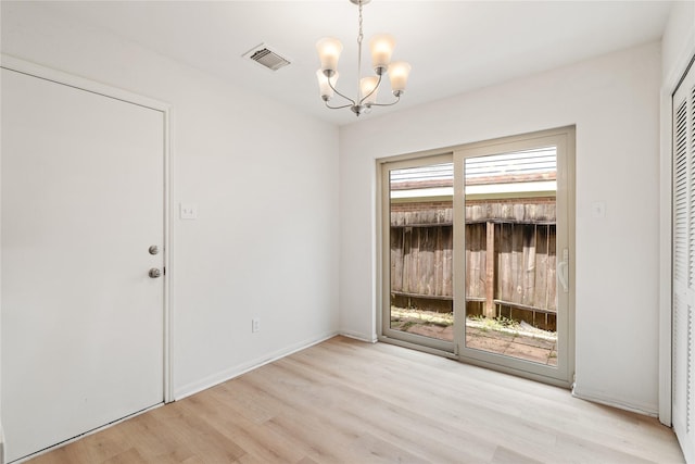 1714 Regal Blue Ct, Fresno, TX 77545 - unfurnished dining area featuring a chandelier and light wood-style flooring