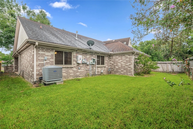 1714 Regal Blue Ct, Fresno, TX 77545 - rear view of property with a shingled roof and brick siding