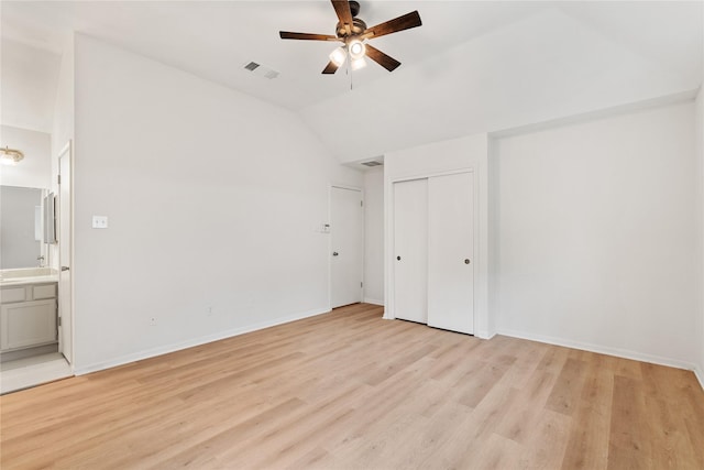 1714 Regal Blue Ct, Fresno, TX 77545 - unfurnished bedroom with light wood-style flooring, lofted ceiling, ensuite bathroom, and a ceiling fan
