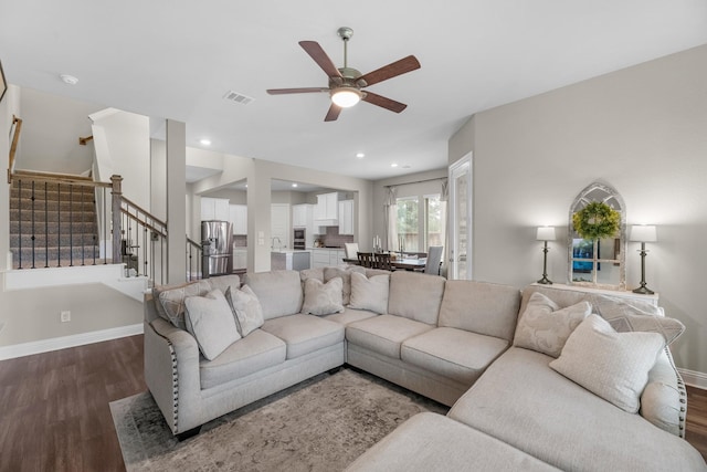 1926 Kingston Meadow Ln, Katy, TX 77494 - living room with dark wood-style flooring, ceiling fan, and stairway
