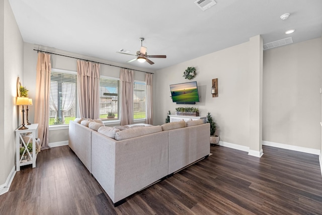 1926 Kingston Meadow Ln, Katy, TX 77494 - living area featuring ceiling fan and dark wood-style flooring