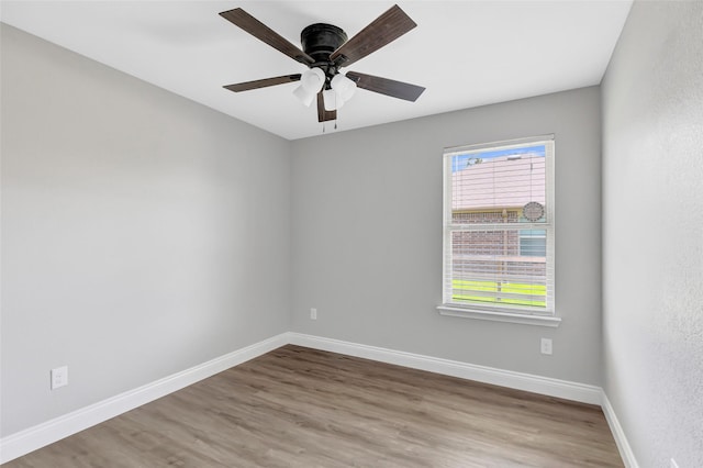 214 Kickapoo Dr, Anahuac, TX 77514 - unfurnished room with wood finished floors and ceiling fan