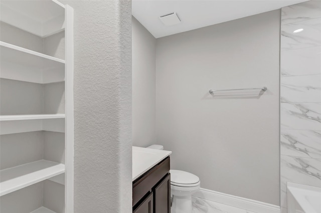 214 Kickapoo Dr, Anahuac, TX 77514 - full bath featuring marble finish floors, vanity, and shower / washtub combination