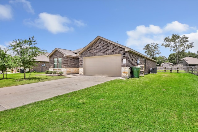 214 Kickapoo Dr, Anahuac, TX 77514 - ranch-style home featuring a garage, brick siding, and concrete driveway
