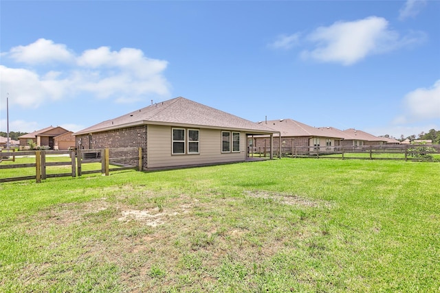 214 Kickapoo Dr, Anahuac, TX 77514 - rear view of house featuring a fenced backyard