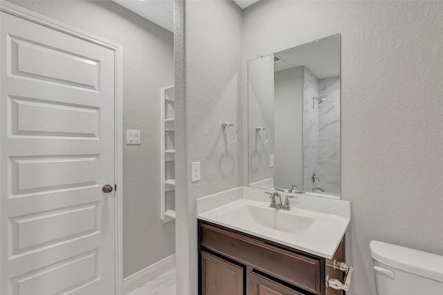 214 Kickapoo Dr, Anahuac, TX 77514 - bathroom with marble look tile flooring, vanity, and a shower
