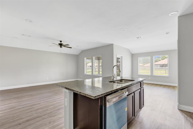 214 Kickapoo Dr, Anahuac, TX 77514 - kitchen featuring stainless steel dishwasher, lofted ceiling, open floor plan, light wood-style flooring, and a ceiling fan