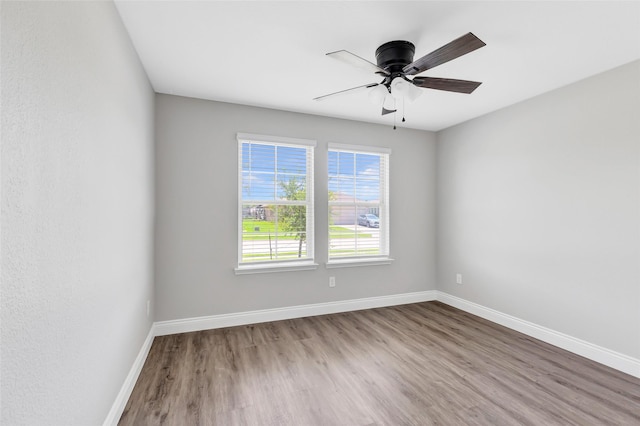 214 Kickapoo Dr, Anahuac, TX 77514 - spare room with wood finished floors and ceiling fan