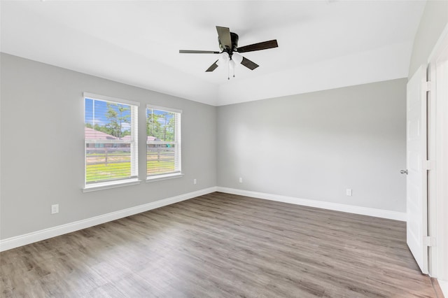 214 Kickapoo Dr, Anahuac, TX 77514 - unfurnished room with wood finished floors and ceiling fan
