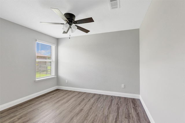 214 Kickapoo Dr, Anahuac, TX 77514 - empty room featuring wood finished floors and ceiling fan