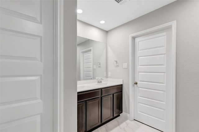 214 Kickapoo Dr, Anahuac, TX 77514 - bathroom with vanity and marble finish flooring