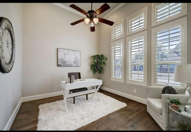 5011 Anthony Springs Ln, Sugar Land, TX 77479 - home office with dark wood-style floors, a ceiling fan, ornamental molding, and a towering ceiling