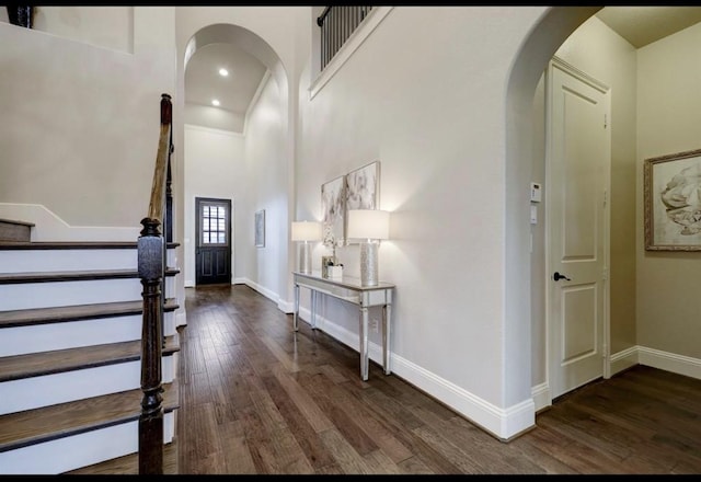 5011 Anthony Springs Ln, Sugar Land, TX 77479 - foyer with wood finished floors, arched walkways, stairs, recessed lighting, and a towering ceiling