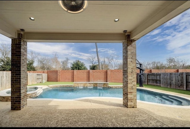 5011 Anthony Springs Ln, Sugar Land, TX 77479 - view of pool featuring a fenced backyard, a pool with connected hot tub, and a patio