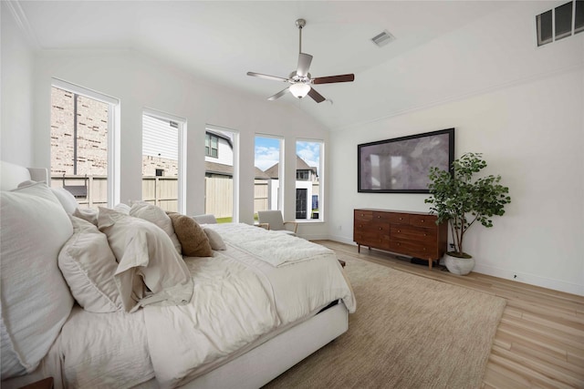 11822 Creekside Shore Cir, Cypress, TX 77433 - bedroom with lofted ceiling, light wood-style flooring, and a ceiling fan