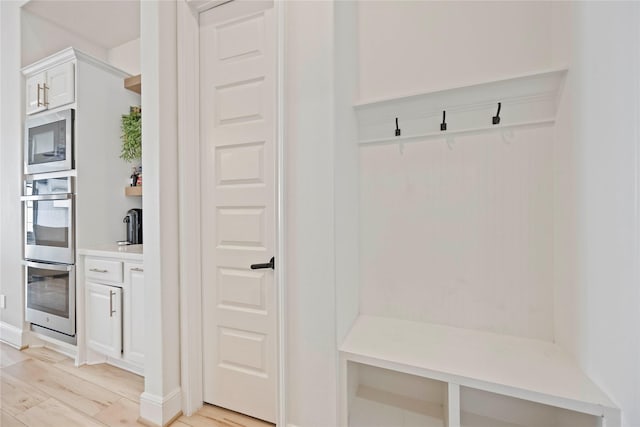11822 Creekside Shore Cir, Cypress, TX 77433 - mudroom with light wood finished floors and baseboards