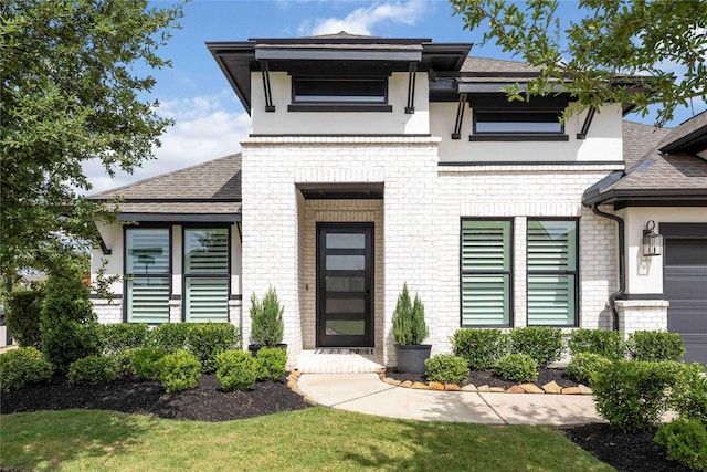 11822 Creekside Shore Cir, Cypress, TX 77433 - view of front of house featuring brick siding, roof with shingles, and stucco siding