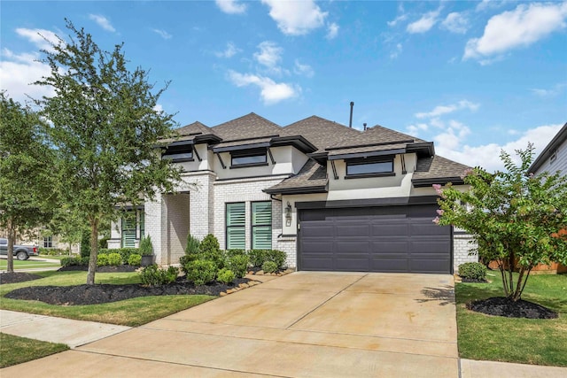 11822 Creekside Shore Cir, Cypress, TX 77433 - prairie-style house featuring concrete driveway, stucco siding, brick siding, a shingled roof, and a garage