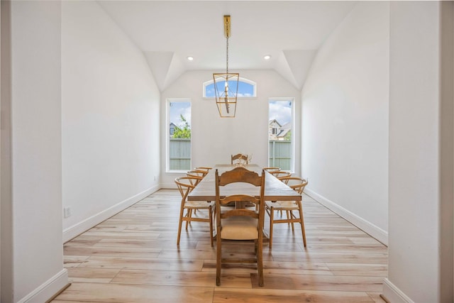 11822 Creekside Shore Cir, Cypress, TX 77433 - dining space with a chandelier, light wood-type flooring, lofted ceiling, and recessed lighting
