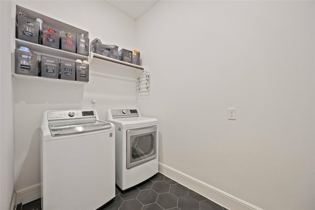 11822 Creekside Shore Cir, Cypress, TX 77433 - washroom featuring separate washer and dryer and dark tile patterned flooring