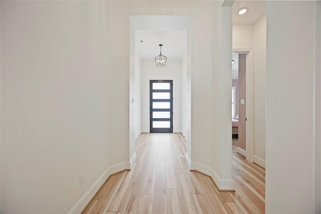 11822 Creekside Shore Cir, Cypress, TX 77433 - doorway to outside featuring light wood-type flooring and baseboards