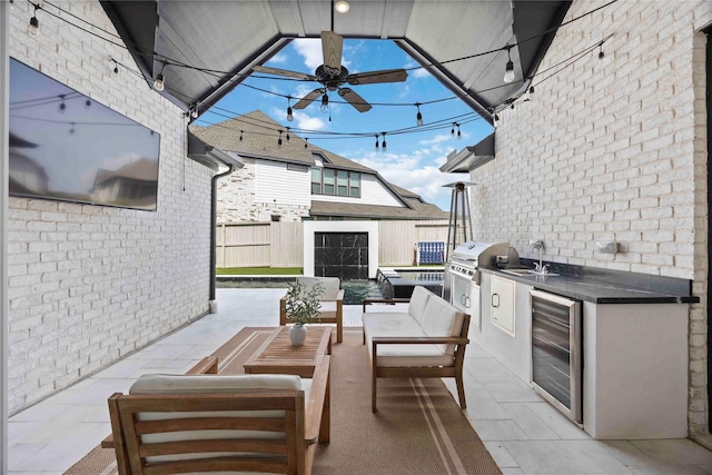 11822 Creekside Shore Cir, Cypress, TX 77433 - view of patio / terrace featuring wine cooler, an outdoor kitchen, a ceiling fan, and an outdoor living space