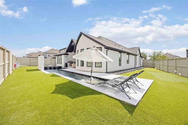 11822 Creekside Shore Cir, Cypress, TX 77433 - rear view of property with a fenced backyard, a patio, brick siding, and a putting green