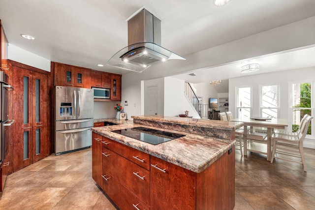 7306 Creek Crest Dr, Houston, TX 77095 - kitchen with appliances with stainless steel finishes, island exhaust hood, glass insert cabinets, a center island, and light stone countertops