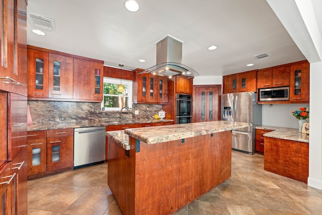 7306 Creek Crest Dr, Houston, TX 77095 - kitchen with stainless steel appliances, island range hood, a kitchen island, brown cabinets, and recessed lighting