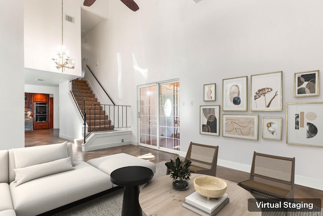 7306 Creek Crest Dr, Houston, TX 77095 - living room with a high ceiling, a chandelier, stairs, and a ceiling fan