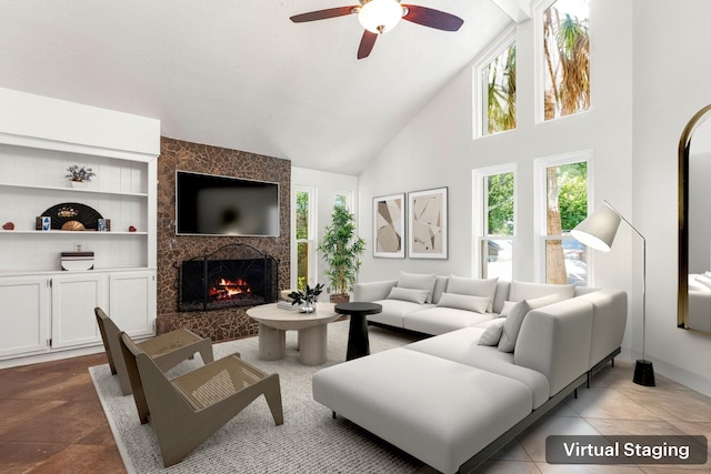7306 Creek Crest Dr, Houston, TX 77095 - living room featuring plenty of natural light, a tile fireplace, high vaulted ceiling, ceiling fan, and built in shelves