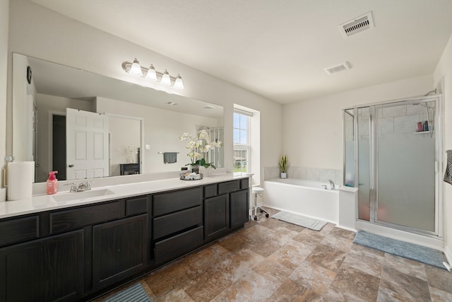 14722 Ruddy Duck Ln, Houston, TX 77049 - bathroom featuring double vanity, a garden tub, and a stall shower