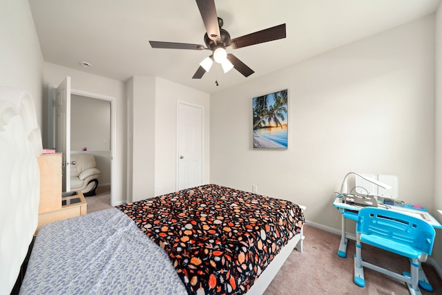 14722 Ruddy Duck Ln, Houston, TX 77049 - carpeted bedroom with a ceiling fan and baseboards