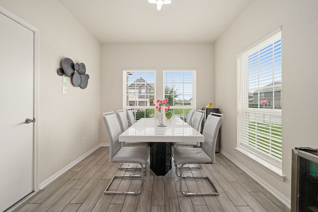 14722 Ruddy Duck Ln, Houston, TX 77049 - dining room with light wood finished floors and plenty of natural light
