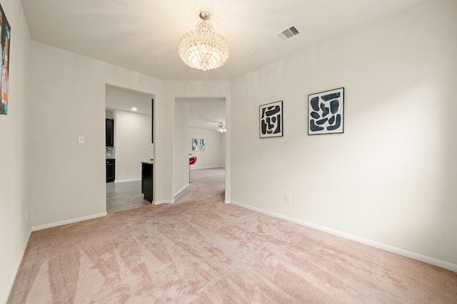 14722 Ruddy Duck Ln, Houston, TX 77049 - empty room with a chandelier and light colored carpet
